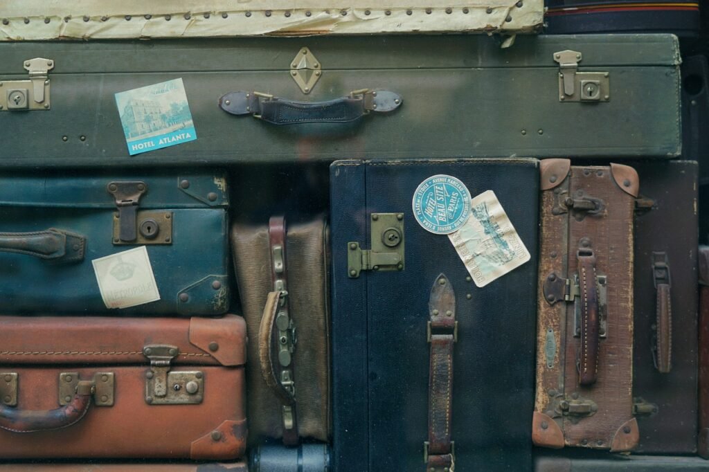 Several old suitcases stacked atop each other