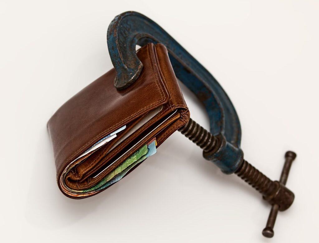 Vise squeezing a wallet