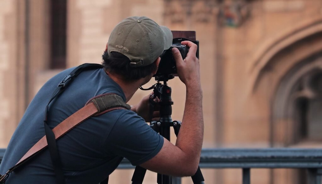 Photographer taking a photo of a building