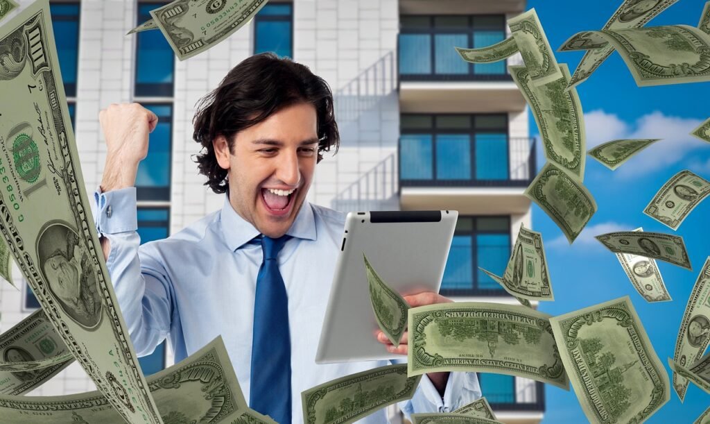 Man holding tablet with dollars raining from sky